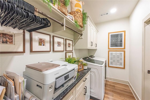 852 Round Top St, Prairie Grove, AR 72753 - laundry room featuring washing machine and clothes dryer, cabinet space, light wood-type flooring, and baseboards