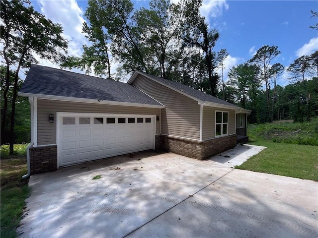 2103 Highland Ct, Dardanelle, AR 72834 - view of front of home with concrete driveway, a garage, roof with shingles, and brick siding