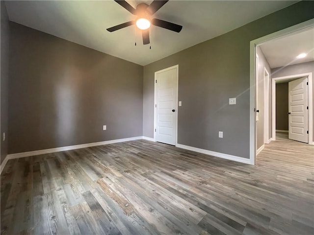 2103 Highland Ct, Dardanelle, AR 72834 - unfurnished room featuring a ceiling fan, baseboards, and wood finished floors