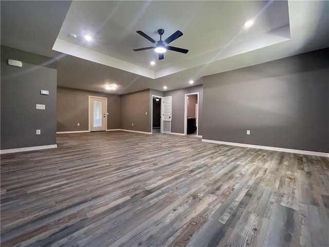 2103 Highland Ct, Dardanelle, AR 72834 - empty room featuring a tray ceiling, dark wood finished floors, a ceiling fan, baseboards, and recessed lighting