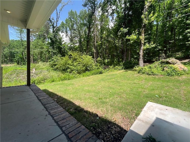 2103 Highland Ct, Dardanelle, AR 72834 - view of grassy yard with a patio area