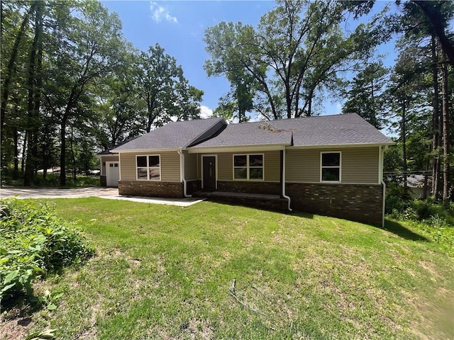 2103 Highland Ct, Dardanelle, AR 72834 - view of front of property featuring brick siding, a garage, driveway, and a front lawn