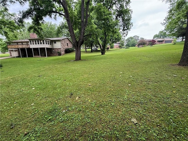 1010 Sherman Ave, Harrison, AR 72601 - view of grassy yard featuring a deck