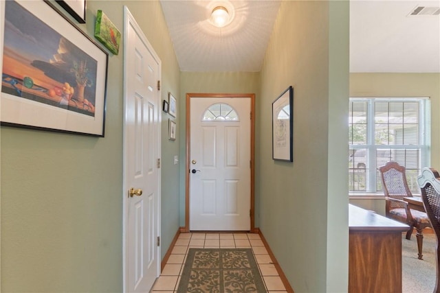 33 Holiday Island Dr, Holiday Island, AR 72631 - doorway with light tile patterned floors and baseboards
