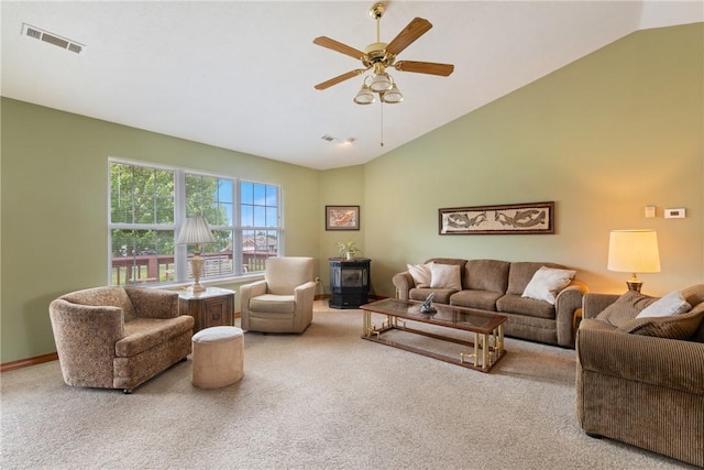 33 Holiday Island Dr, Holiday Island, AR 72631 - carpeted living room with ceiling fan, a wood stove, and high vaulted ceiling