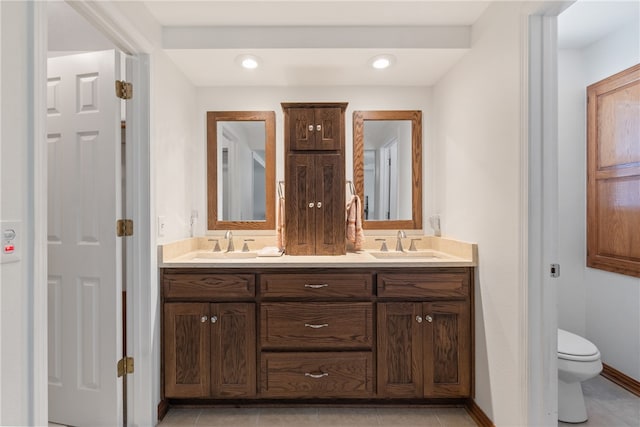 33 Holiday Island Dr, Holiday Island, AR 72631 - full bathroom with double vanity, toilet, tile patterned floors, and recessed lighting