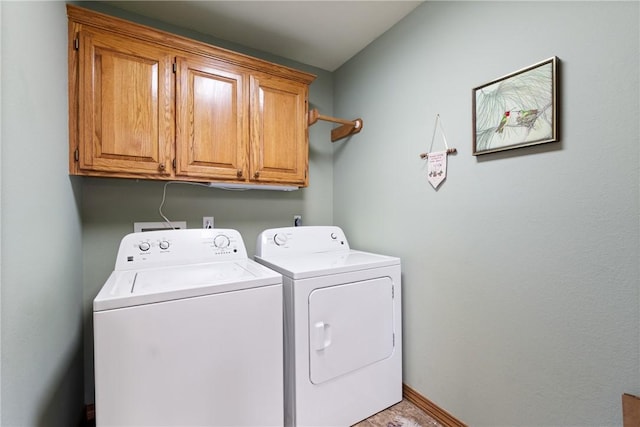 33 Holiday Island Dr, Holiday Island, AR 72631 - laundry area featuring cabinet space, washing machine and clothes dryer, and baseboards
