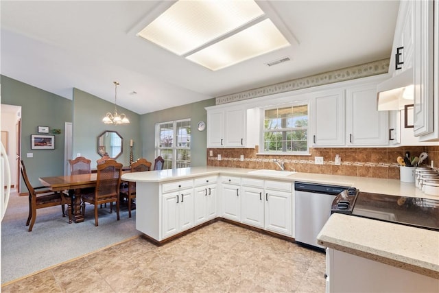 33 Holiday Island Dr, Holiday Island, AR 72631 - kitchen with a sink, a peninsula, stainless steel dishwasher, lofted ceiling, and white cabinetry