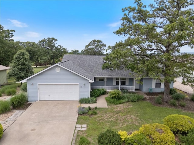 33 Holiday Island Dr, Holiday Island, AR 72631 - ranch-style house featuring a porch, driveway, a garage, roof with shingles, and a front lawn
