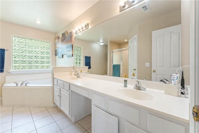 4730 Woodside Ln, Springdale, AR 72762 - bathroom featuring double vanity, a stall shower, a garden tub, and tile patterned floors