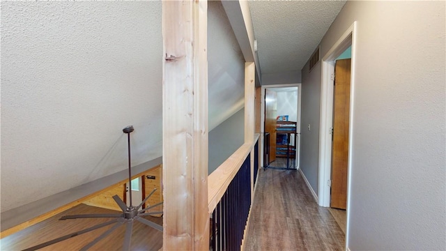 104 NE Deer Ridge Rd, Gravette, AR 72736 - hall featuring dark wood finished floors and a textured ceiling