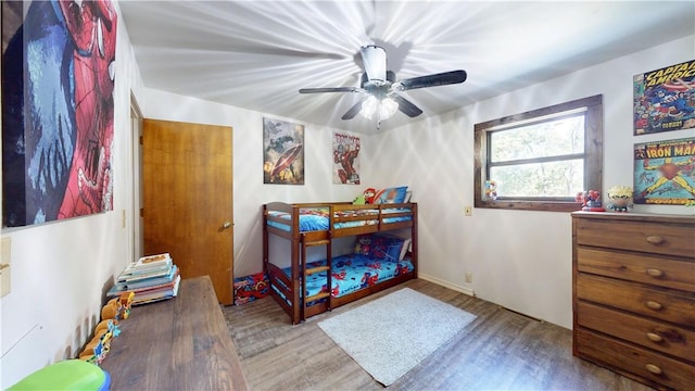 104 NE Deer Ridge Rd, Gravette, AR 72736 - bedroom with wood finished floors and a ceiling fan