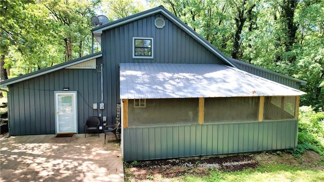104 NE Deer Ridge Rd, Gravette, AR 72736 - view of front of property with a patio area and board and batten siding