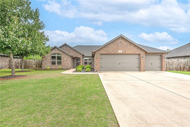 1805 SW Birch St, Bentonville, AR 72713 - view of front facade featuring brick siding, an attached garage, concrete driveway, and a shingled roof