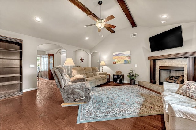 1805 SW Birch St, Bentonville, AR 72713 - living area with arched walkways, a ceiling fan, recessed lighting, a tile fireplace, and wood finished floors