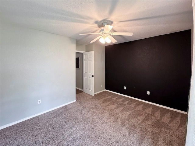 4408 W Apache Trl, Fayetteville, AR 72704 - carpeted empty room featuring ceiling fan, baseboards, and a textured ceiling