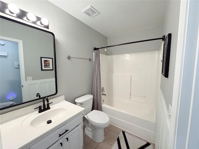 4408 W Apache Trl, Fayetteville, AR 72704 - full bath featuring tile patterned floors, vanity, toilet, shower / bath combination with curtain, and a textured ceiling