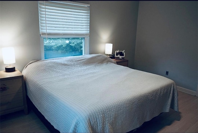 1211 N Mission Blvd, Fayetteville, AR 72701 - bedroom featuring wood finished floors and baseboards