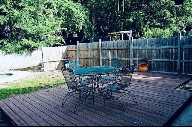 1211 N Mission Blvd, Fayetteville, AR 72701 - wooden deck featuring outdoor dining space