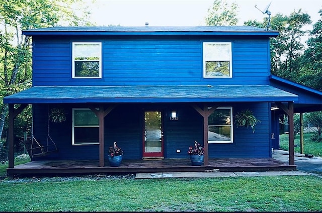 1211 N Mission Blvd, Fayetteville, AR 72701 - view of front of house with a porch, a front lawn, and roof with shingles