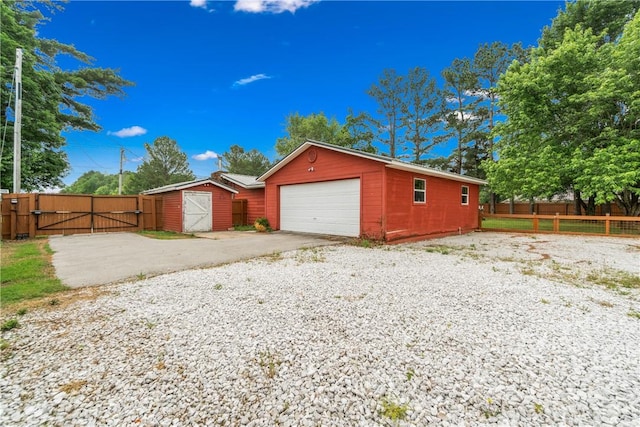 12549 Little Elm Rd, Farmington, AR 72730 - garage with a gate