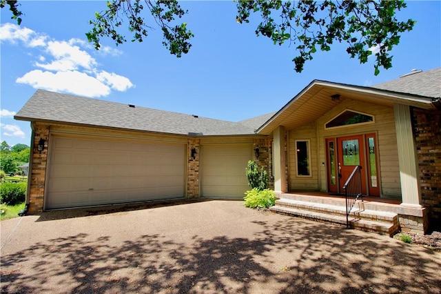 70 Shields Spur, Holiday Island, AR 72631 - ranch-style home featuring a garage, driveway, brick siding, and roof with shingles