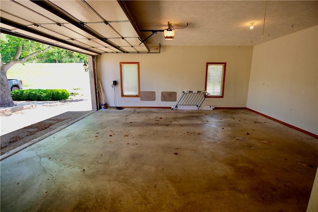70 Shields Spur, Holiday Island, AR 72631 - garage featuring baseboards and a garage door opener