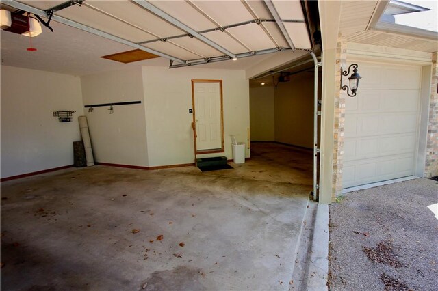 70 Shields Spur, Holiday Island, AR 72631 - garage with a garage door opener and baseboards