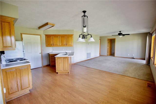 70 Shields Spur, Holiday Island, AR 72631 - kitchen featuring a sink, baseboards, and ceiling fan