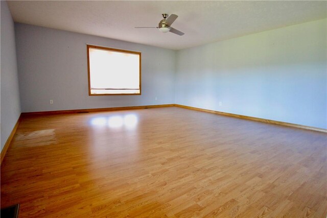 70 Shields Spur, Holiday Island, AR 72631 - empty room featuring wood finished floors, baseboards, and ceiling fan