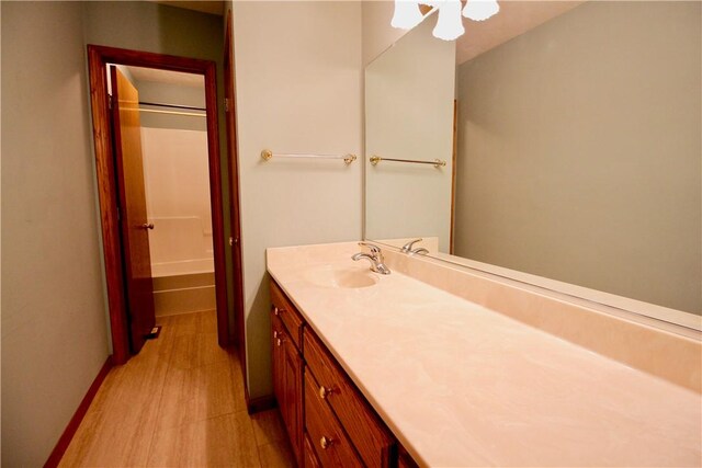 70 Shields Spur, Holiday Island, AR 72631 - full bath featuring vanity, baseboards, and washtub / shower combination