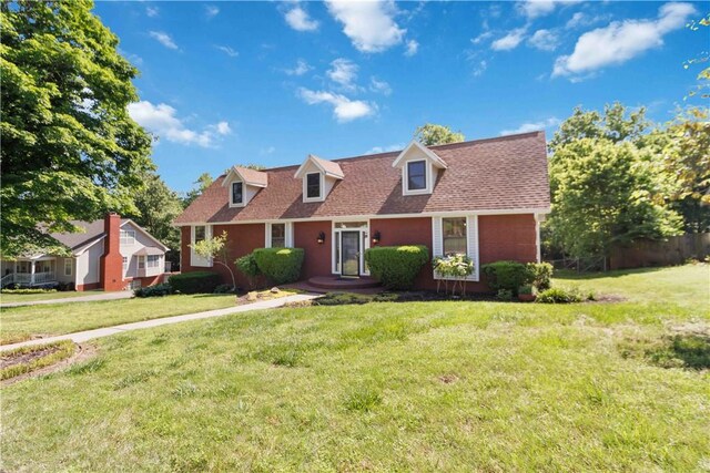 1640 N Boston Pl, Fayetteville, AR 72703 - new england style home featuring a front lawn and a shingled roof