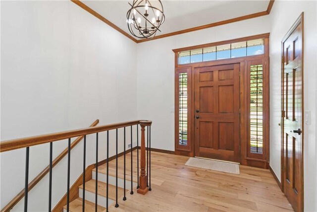 1640 N Boston Pl, Fayetteville, AR 72703 - foyer featuring a chandelier, ornamental molding, light wood-style flooring, and baseboards