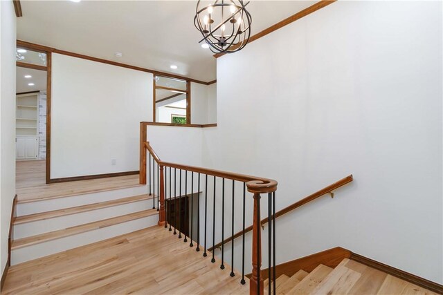 1640 N Boston Pl, Fayetteville, AR 72703 - stairway with wood finished floors, a chandelier, and recessed lighting