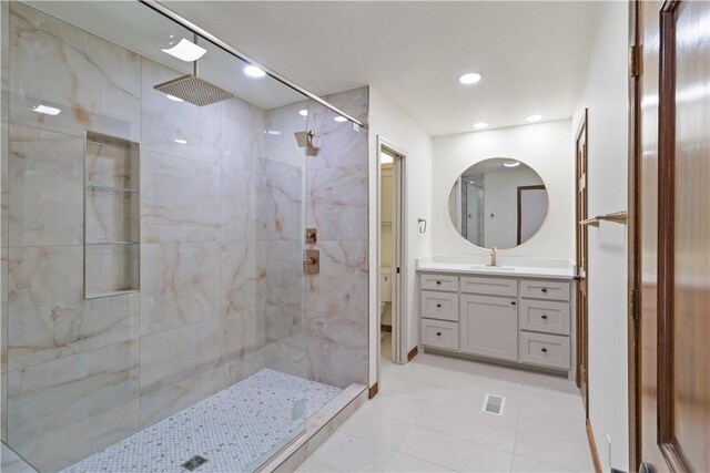1640 N Boston Pl, Fayetteville, AR 72703 - full bathroom featuring tiled shower, tile patterned flooring, vanity, and recessed lighting