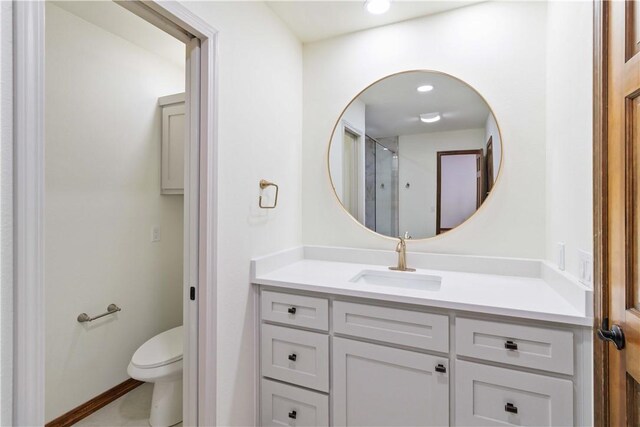 1640 N Boston Pl, Fayetteville, AR 72703 - bathroom with toilet, vanity, and a shower with shower door
