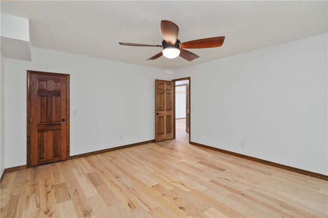 1640 N Boston Pl, Fayetteville, AR 72703 - spare room with light wood-style floors, ceiling fan, and baseboards