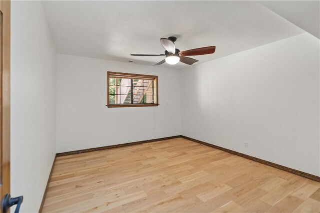 1640 N Boston Pl, Fayetteville, AR 72703 - empty room with light wood-style flooring, a ceiling fan, and baseboards