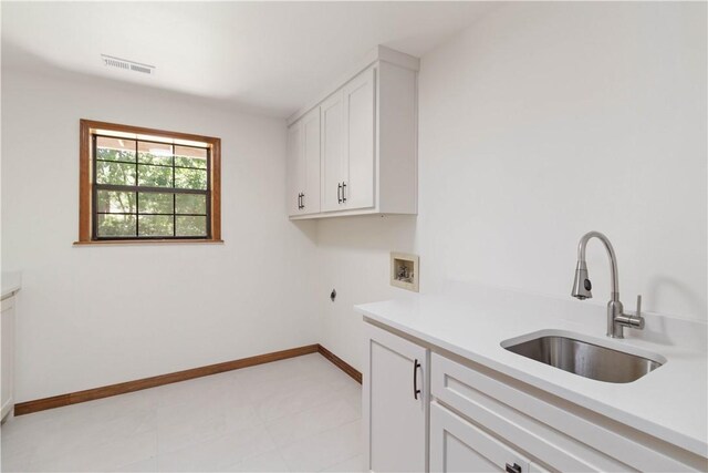 1640 N Boston Pl, Fayetteville, AR 72703 - washroom with cabinet space, washer hookup, electric dryer hookup, and baseboards