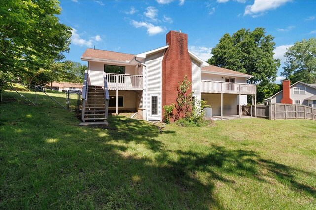 1640 N Boston Pl, Fayetteville, AR 72703 - back of house with stairs, a chimney, and a wooden deck