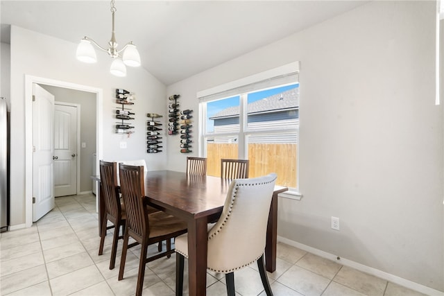 2405 Maplewood Ave, Lowell, AR 72745 - dining room featuring vaulted ceiling, a chandelier, baseboards, and light tile patterned floors