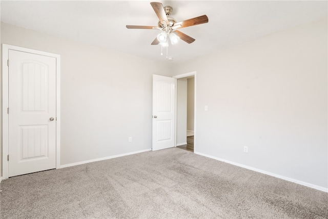 2405 Maplewood Ave, Lowell, AR 72745 - spare room with carpet, ceiling fan, and baseboards