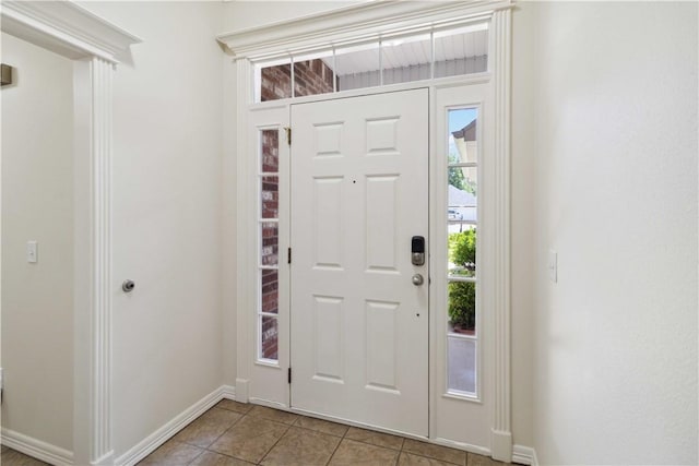 603 Highland Ct, Siloam Springs, AR 72761 - entrance foyer with healthy amount of natural light, light tile patterned floors, and baseboards