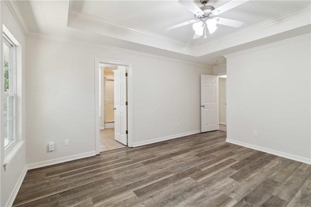 603 Highland Ct, Siloam Springs, AR 72761 - unfurnished bedroom featuring wood finished floors, a raised ceiling, baseboards, and crown molding