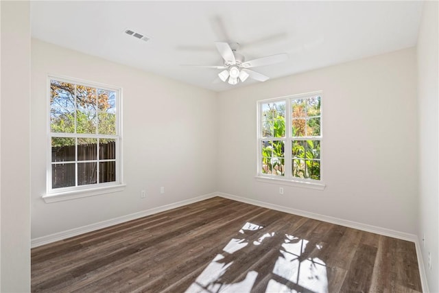 603 Highland Ct, Siloam Springs, AR 72761 - unfurnished room with baseboards, wood finished floors, and a ceiling fan