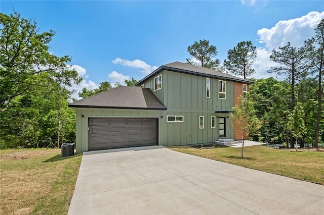 2 Brightling Ln, Bella Vista, AR 72715 - view of side of home featuring board and batten siding, concrete driveway, roof with shingles, an attached garage, and a lawn