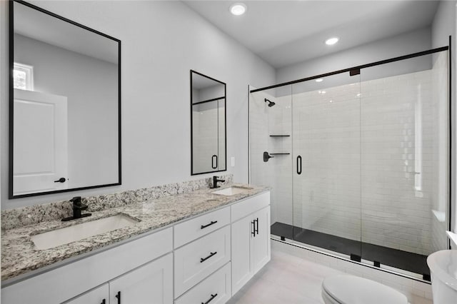 2 Brightling Ln, Bella Vista, AR 72715 - full bathroom with a shower stall, toilet, double vanity, recessed lighting, and tile patterned flooring
