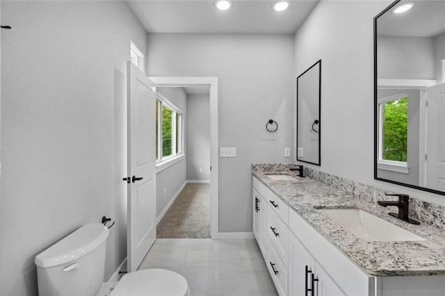 2 Brightling Ln, Bella Vista, AR 72715 - full bath featuring toilet, baseboards, recessed lighting, double vanity, and marble finish flooring