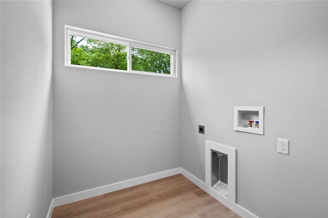 2 Brightling Ln, Bella Vista, AR 72715 - laundry area with hookup for an electric dryer, washer hookup, wood finished floors, and baseboards