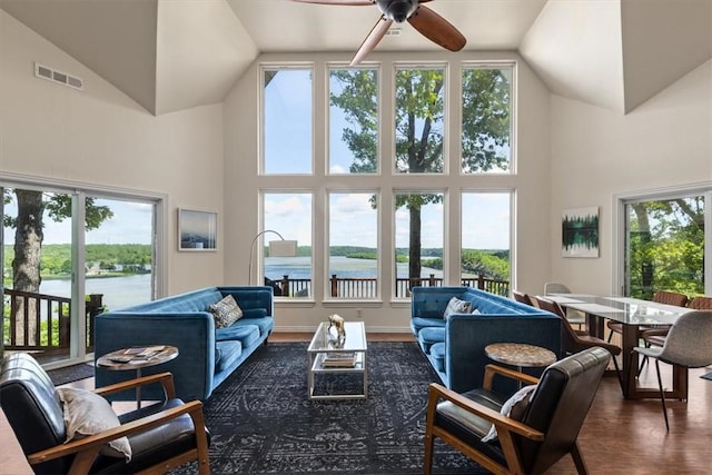 15100 Railroad Cut Rd, Rogers, AR 72756 - living area with high vaulted ceiling, healthy amount of natural light, a ceiling fan, dark wood finished floors, and a water view